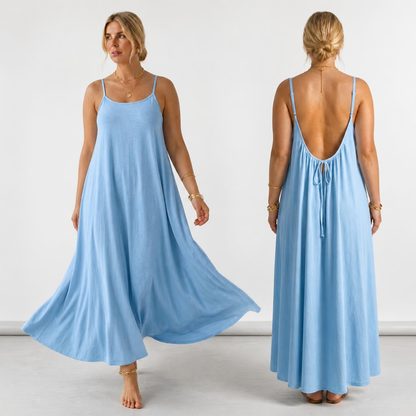 A woman modeling a light blue maxi dress in two views: front and back. The dress has thin straps, a flowing silhouette, and a tie-back detail at the open back.